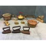 Miscellaneous brass & copper fireside pieces including a kettle stand, flat irons, a cauldron with