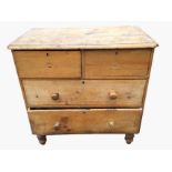 A Victorian pine chest of drawers with rectangular rounded top above two short and two long drawers,