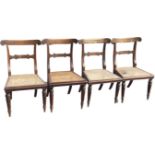 A set of four faux rosewood regency dining chairs, the acanthus leaf carved back rails inlaid with