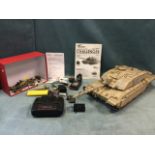 A Torro radio controlled toy tank with instructions and remote. (A/F)