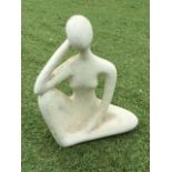 A contemporary resin Moore style figure of a seated lady. (9in x 12in x 5in)