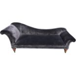 A Victorian mahogany chaise longue reupholstered in charcoal velvet, having shaped tapering back