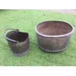 A nineteenth century riveted oval copper log bin with flat rim; and a brass coal scuttle with