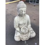A seated composition stone young Buddha, the cross-legged figure dressed in robes holding supplicant