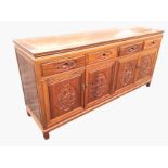 A Chinese hardwood sideboard with rectangular panelled top above four frieze drawers and four