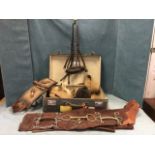 Miscellaneous horse tack including a Herbert Johnson cap, leather chaps, girth straps, a long canvas