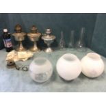 Three chrome oil lamps with miscellaneous shades, chimneys, oil lamp parts and mantles, lamp oil,