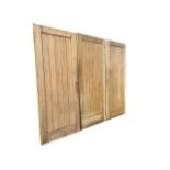 A set of three modern oak boarded type doors - 33in x 78in. (3)