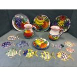Miscellaneous brightly decorated Italian ceramics including platters, jugs, decorative wall mounting