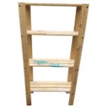 A contemporary pine shelf unit wth four platforms. (34in x 13.5in x 68.5in)