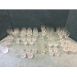 A quantity of drinking glasses, mainly sets, wine glasses, brandy balloons, tumblers, flutes, hi-