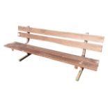 A rectangular garden bench on square metal frame, with twin-plank seat and bar back. (82.5in)