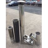 Miscellaneous lengths and pieces of insulated flue pipe, including a junction, some unused, a