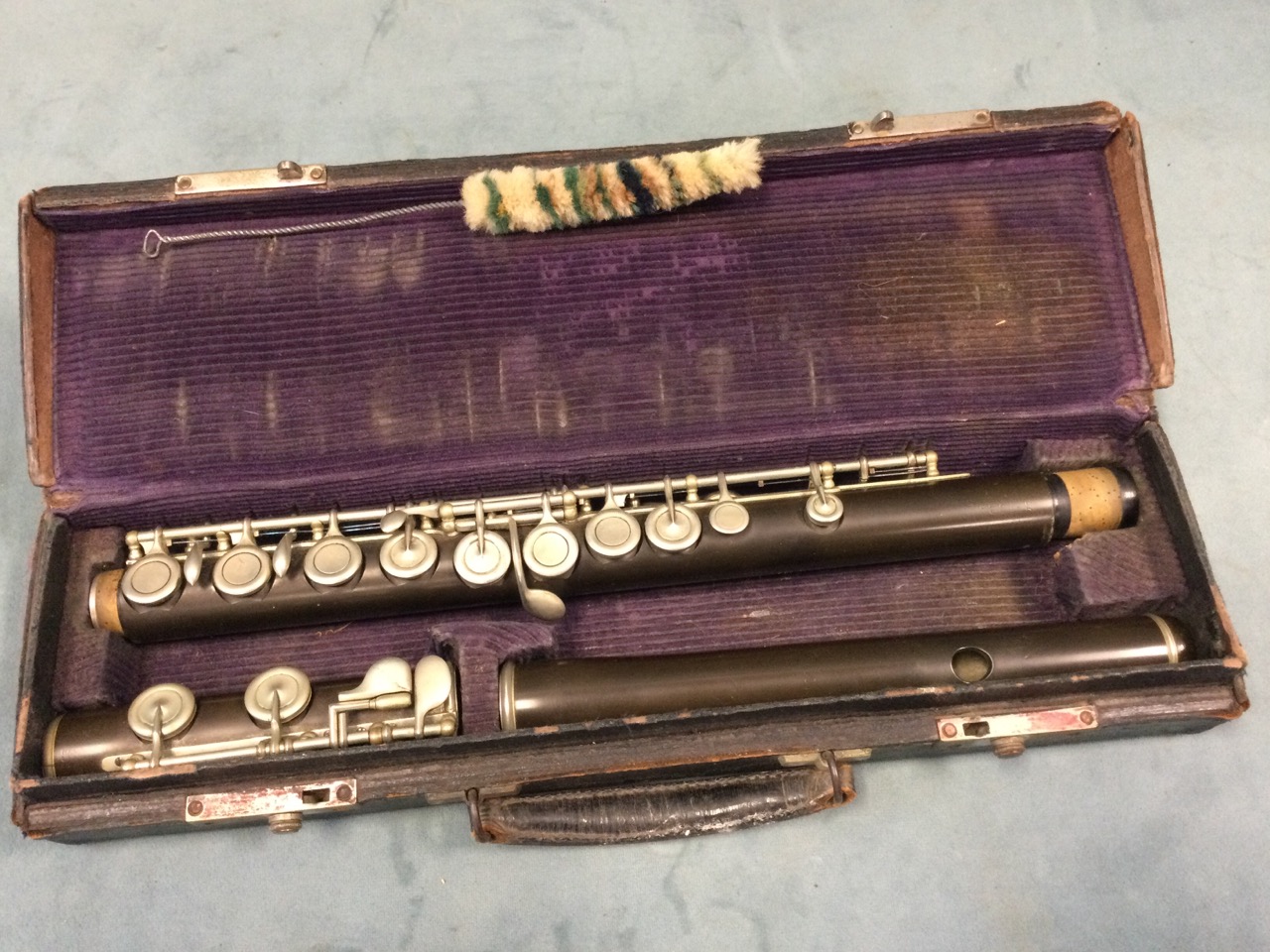 An Edwardian cased flute, the bakelite instrument with chromed mounts - rubbed marks. (26.5in)