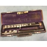 An Edwardian cased flute, the bakelite instrument with chromed mounts - rubbed marks. (26.5in)