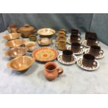 Miscellaneous studio pottery including bowls, tankards, a stoneware soup set, a slipware plate, etc;