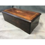 A nineteenth century Swiss rosewood cased musical box, the case with ebonised moulding inlaid with