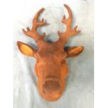 A wall mounting rusty cast iron stags head. (25in)