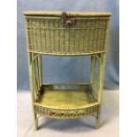 An Edwardian bowfronted cane sewing table, the lined box with hinged lid above a tray shelf with