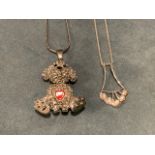 A crystal pendant of a dog holding a red heart, on a 28in silver rope chain; and a silver coloured