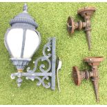 A large Victorian style wall light with scrolled bracket supporting lantern with bulbous milk