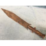 A nineteenth century Tetela sword from the Congo, the shaped blade with barbs having hardwood turned