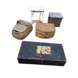 A hammered pewter style bin with lattice front; two cane picnic baskets; a waisted enamelled baby