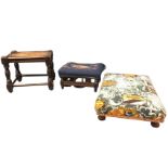 An upholstered rectangular low stool; a floral needlework upholstered footstool with turned