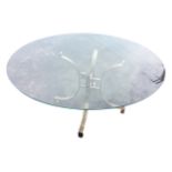 A contemporary circular 5ft glass topped Italian dining table, the plate glass on waisted curved