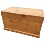 A rectangular Victorian pine blanket box of dovetailed construction with brass hinges and