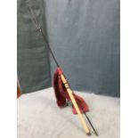An Abu Garcia Agenda 9ft graphite composite salmon spinning rod - looks hardly used, with cloth