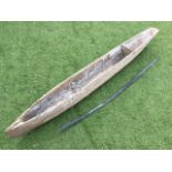 A nineteenth century 6ft pine boat adzed out of a solid trunk, the hull with traces of original