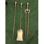 A set of three brass fire irons with ball finials to shafts - poker, tongs & shovel. (3)