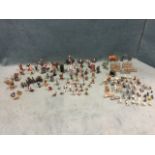 A collection of lead soldiers, figures, animals, farm fences, canons, some by Britains, a dog