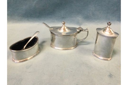 A three-piece hallmarked silver cruet set of oval form with ribbed moulded borders, the mustard & - Image 1 of 3