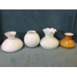 Four miscellaneous milk glass oil lamp shades. (4)