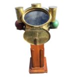 A Victorian Lord Kelvin brass ships binnacle on square mahogany column stand, the working brass