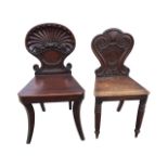 A nineteenth century mahogany hall chair with shell carved scrolled back above a tapering seat