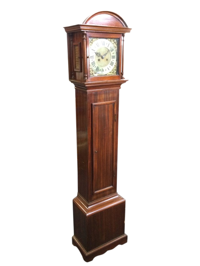 A mahogany cased grandmother clock with arched hood above square door framed by turned columns