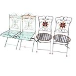 A pair of painted folding garden chairs with scrolled decoration to backs above slatted seats; and
