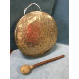 A circular hammered brass gong, the leather ball hammer with brass ring terminal. (14.75in) (2)