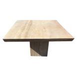 A contemporary square marble dining table, the top with angled edge raised on plain central