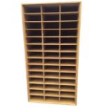 A modern cabinet with forty-two rectangular pigeonholes raised on metal stand with tubular feet. (