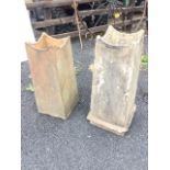 A pair of square tapering stoneware chimney pots with concave shaped rims, one with cemented plinth.