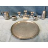 A married hammered pewter set on circular tray; and a silver plated candelabra with three