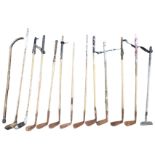 Twelve hickory shafted rusty old golf clubs - nine irons, two drivers and a brass headed putter. (