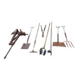 A portable cast iron pole vice; and a quantity of garden tools - shovel, spade, fork, etc. (A lot)