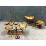 A pair of Victorian cast iron scales by Avery with brass trays; another similar smaller set; and a