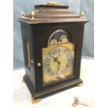 An eighteenth century style ebonised German bracket clock by Kieninger, with caddy moulded top above