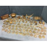 Miscellaneous brass including ornaments, a collection of horse brasses, candlesticks, a kettle